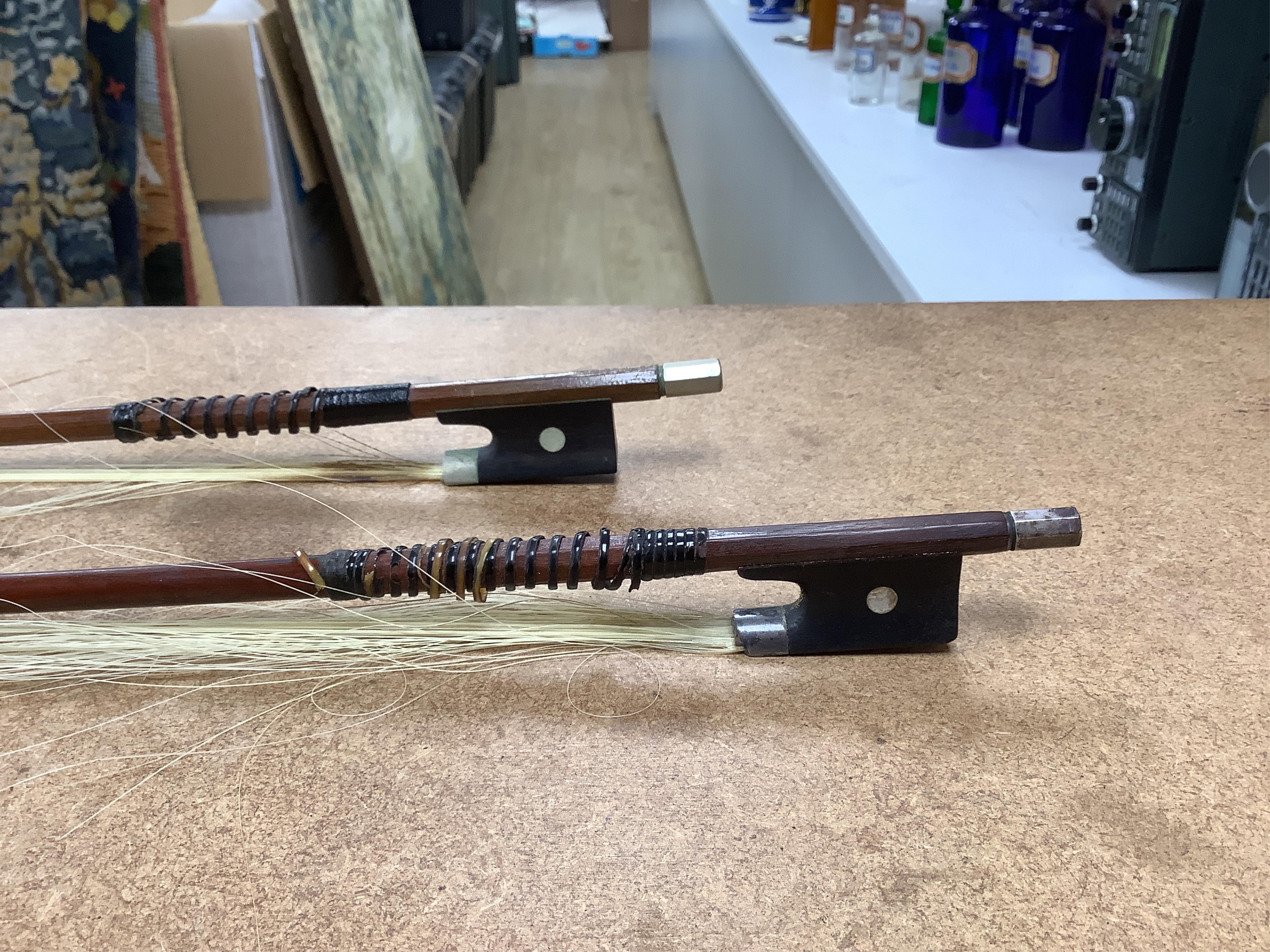 A late 19th century German violin in a Hill & Son oak case, with Hill canvas slip cover, together with an unbranded silver mounted bow, and another, ivory submission ref: 9HJU3B45 and ZC2E1GCP